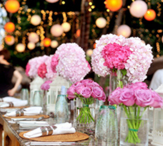 Table decorated for an event with pink flowers