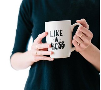 Woman holding mug with the words on it: "like a boss" 