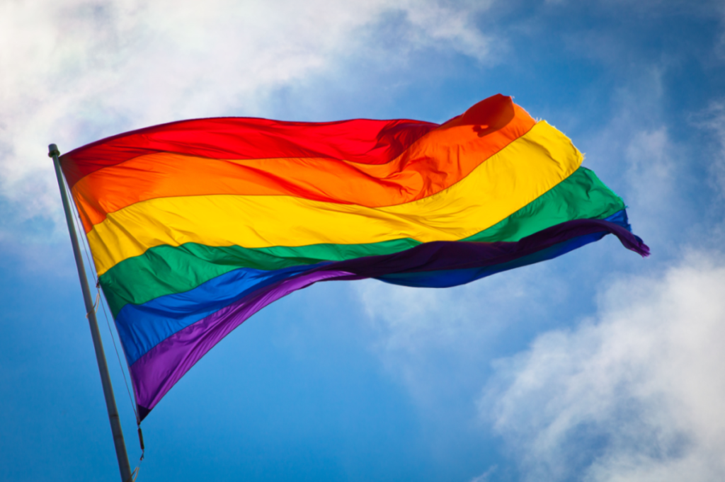 Pride Flag against a blue sky